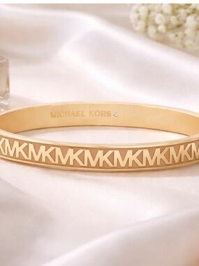 Michael Kors Gold-tone MK Cutout Bangle Bracelet